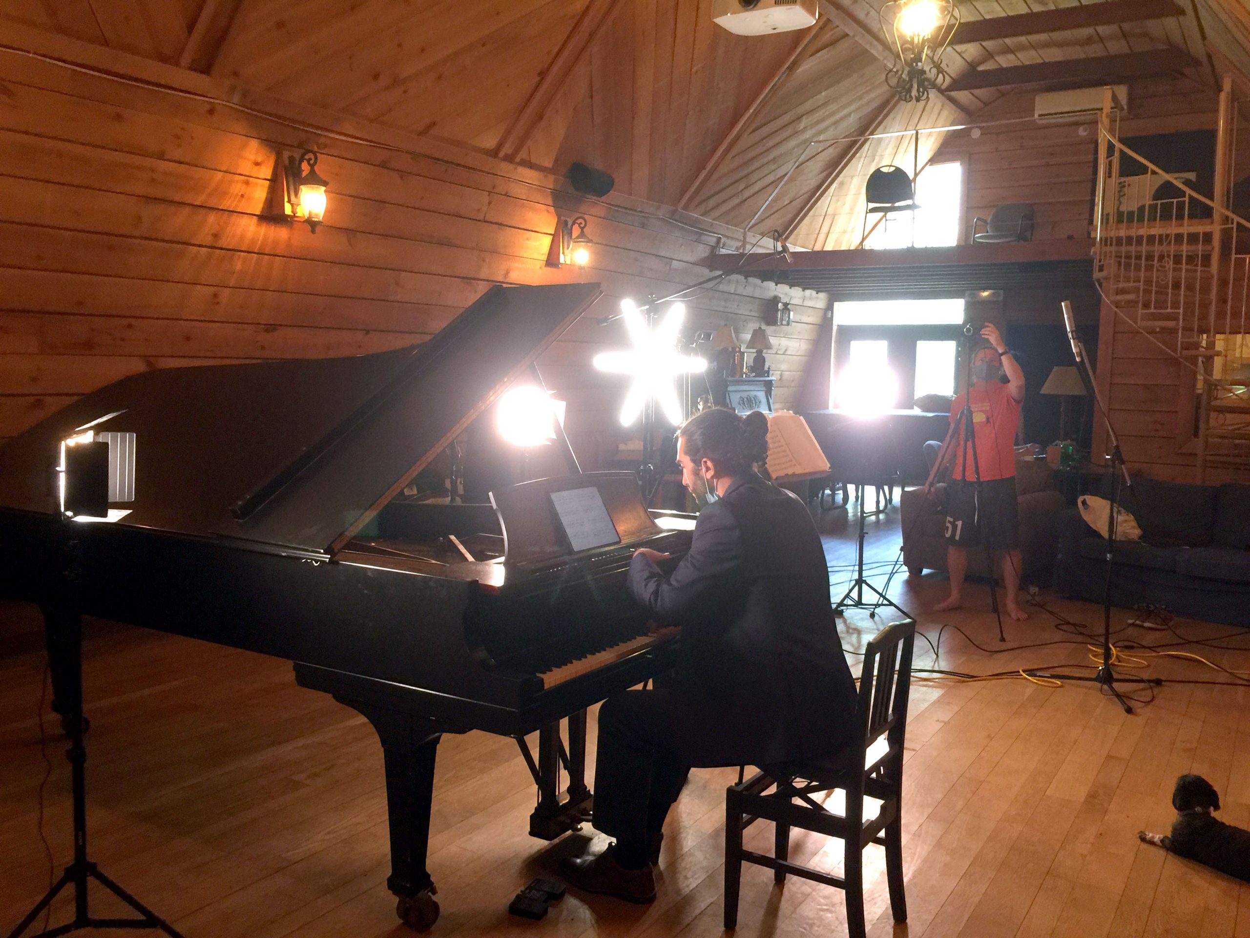 Tait Becke makes sure all the tech is working in order to live stream Pontiac Enchanté’s virtual concerts, while pianist Suren Barry plays. It was in preparartion for their final concert of the 2020/2021 season featuring Barry and violinist Sofia Yatsyuk.