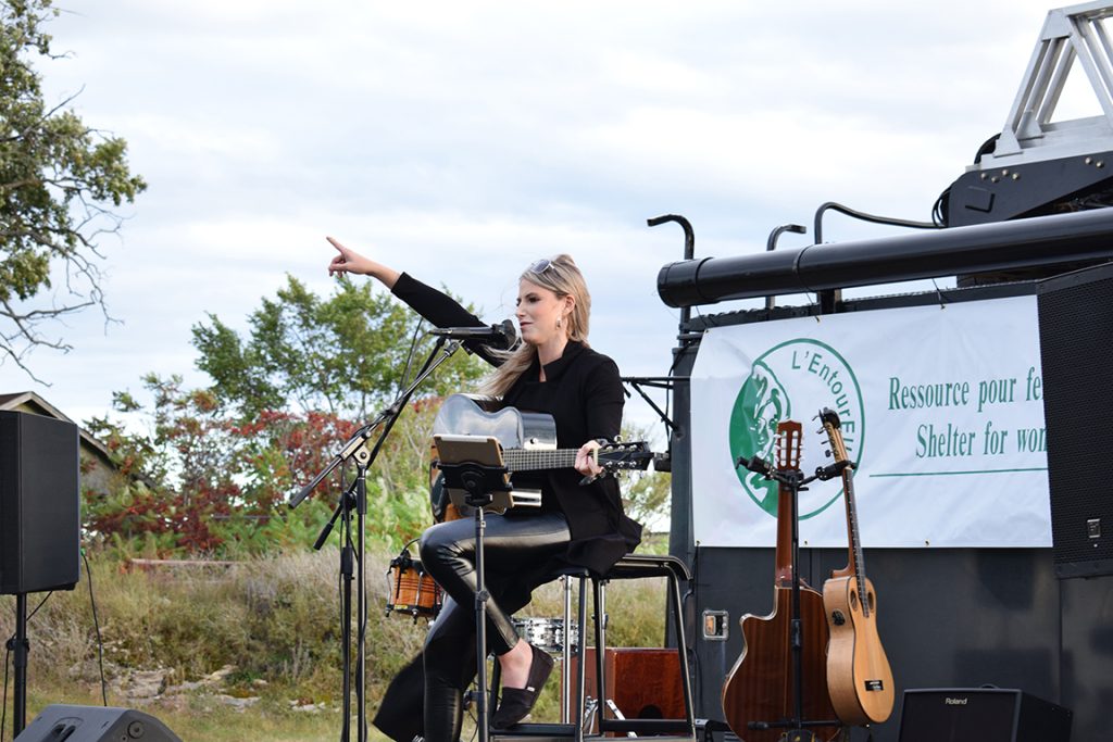 Michaela Cahill performing at  Esprit Rafting in Mansfield last Sunday. She performed covers of “House of the Rising Sun” by the Animals, “Fulsome Prison Blues” by Johnny Cash and more.