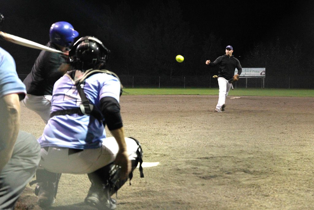 Pitcher for Young’s Appliance Royals, Gregg Garrity  throws a screamer at catcher, Darron Barr. Both teams played a fierce game of pitching, but the Royals would ultimately lose to the Bucks 3-0 after 7 innings 