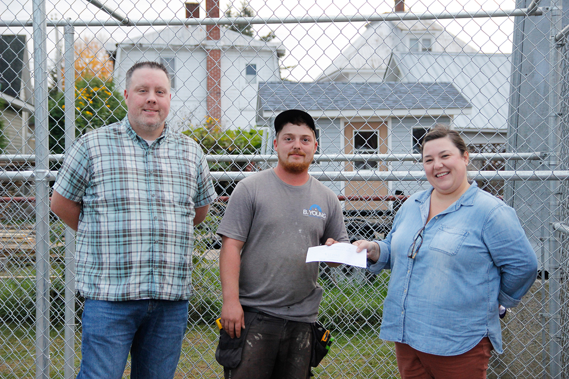 Left to right: Representatives from the Campbell’s Bay Adult 3 Pitch Fun League, Tim Ferrigan and DJ Dagenais, present Campbell’s Bay Director General Sarah Bertrand with a cheque for $11,040.00. The donation will be used for the construction of new dugouts.